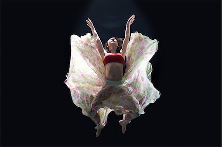 simsearch:614-08875951,k - Dancer in midair wearing tutu Photographie de stock - Premium Libres de Droits, Code: 614-08875947