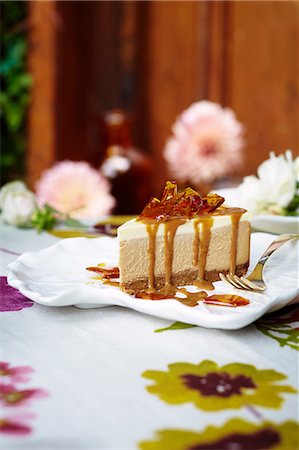 Cheesecake with salted caramel syrup Stock Photo - Premium Royalty-Free, Code: 614-08875999