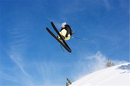 simsearch:6113-08655494,k - Male skier jumping mid air on mountain Stock Photo - Premium Royalty-Free, Code: 614-08876186