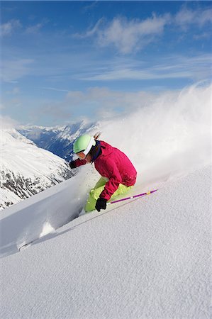 simsearch:614-08876215,k - Woman skiing downhill Foto de stock - Sin royalties Premium, Código: 614-08876194