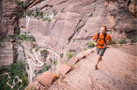 Male trail runner on the Angels Landing trail, Banff National Park, Alberta, Canada Stock Photo - Premium Royalty-Free, Code: 614-08876521