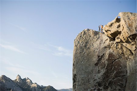 simsearch:614-08876523,k - Male,and female climbers on top of "Tribal Boundaries" 5.10a - Flaming Rock, City of Rocks, Idaho, USA Foto de stock - Royalty Free Premium, Número: 614-08876534