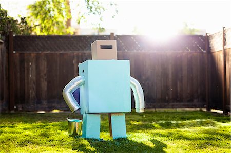 futuristic imagination - Home made light blue robot in garden Stock Photo - Premium Royalty-Free, Code: 614-08876761