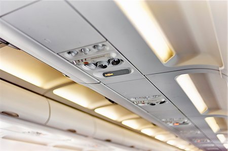 Ceiling of airplane above passenger seat Stock Photo - Premium Royalty-Free, Code: 614-08876850