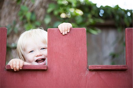 parapet - Young boy peeking Stock Photo - Premium Royalty-Free, Code: 614-08876851