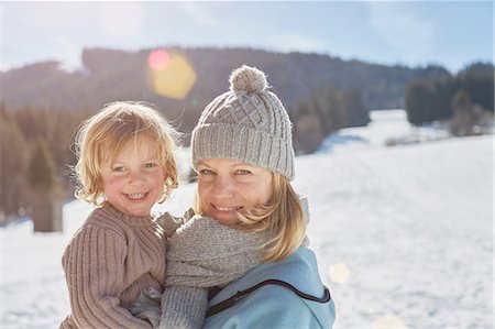 snow kids fun - Mother and son enjoying day out in snow Stock Photo - Premium Royalty-Free, Code: 614-08877260