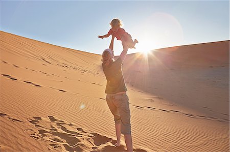 sossusvlei dunes - Mother playing with son on sand dune, Namib Naukluft National Park, Namib Desert, Sossusvlei, Dead Vlei, Africa Stock Photo - Premium Royalty-Free, Code: 614-08877463