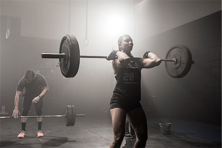 simsearch:614-08877527,k - Young woman lifting barbell Stock Photo - Premium Royalty-Free, Code: 614-08877535