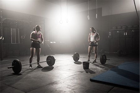 simsearch:614-08877527,k - Two young women preparing to lift barbells Stock Photo - Premium Royalty-Free, Code: 614-08877530