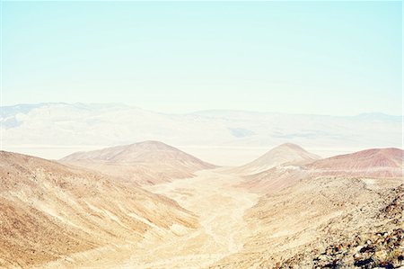 View of valley and distant mountains, Death Valley, California, USA Stock Photo - Premium Royalty-Free, Code: 614-08877551