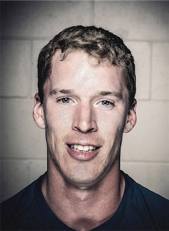 Portrait of smiling sweaty young man after crossfit training Stock Photo - Premium Royalty-Free, Code: 614-08877640