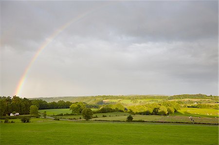 Rural landscape with rainbow and storm clouds Stock Photo - Premium Royalty-Free, Code: 614-08877672