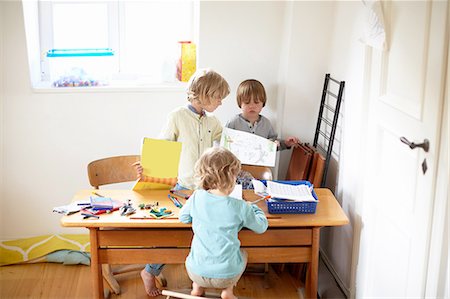 simsearch:614-08872573,k - Three boys sitting at table drawing pictures Stock Photo - Premium Royalty-Free, Code: 614-08877793