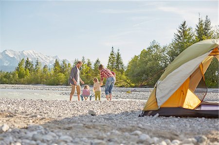 simsearch:6124-08945929,k - Rear view of family playing in river by tent, Wallgau, Bavaria, Germany Photographie de stock - Premium Libres de Droits, Code: 614-08877846