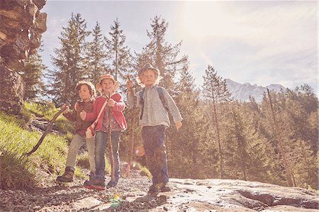 ehrwald - Three children exploring forest Stock Photo - Premium Royalty-Free, Code: 614-08877974