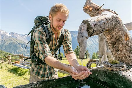 simsearch:649-08949542,k - Young male hiker drinking water from rustic trough, Karthaus, Val Senales, South Tyrol, Italy Photographie de stock - Premium Libres de Droits, Code: 614-08878120