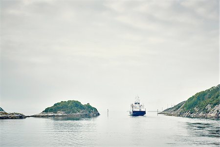 simsearch:649-08824843,k - Boat on water between islands, Haugesund, Rogaland County, Norway Stock Photo - Premium Royalty-Free, Code: 614-08878134
