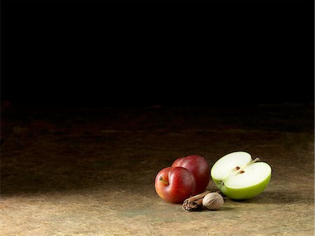 simsearch:649-08423060,k - Apple, plums and nutmeg on surface Stock Photo - Premium Royalty-Free, Code: 614-08878301