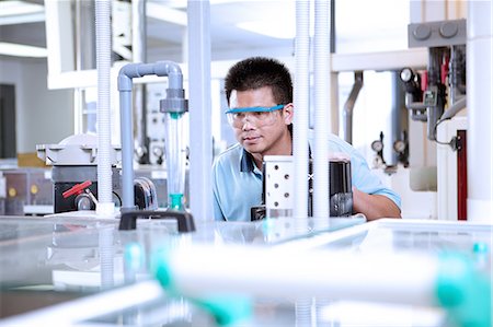 simsearch:649-07064833,k - Man wearing safety goggles in flexible electronics plant Stock Photo - Premium Royalty-Free, Code: 614-08878463