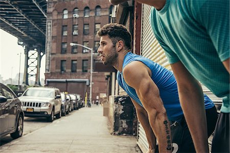 simsearch:614-08878648,k - Two young male runners exhausted on city street Photographie de stock - Premium Libres de Droits, Code: 614-08878683