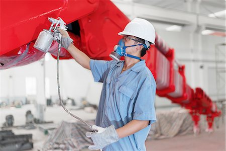 simsearch:614-08878042,k - Male worker spray painting a crane arm red in factory workshop, China Stockbilder - Premium RF Lizenzfrei, Bildnummer: 614-08878857