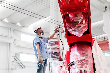 simsearch:614-08878042,k - Male factory worker spray painting a red crane in factory, China Stockbilder - Premium RF Lizenzfrei, Bildnummer: 614-08878851