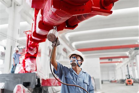 simsearch:614-08878042,k - Male workers spray painting a crane arm red in factory workshop, China Stockbilder - Premium RF Lizenzfrei, Bildnummer: 614-08878853