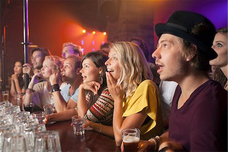 simsearch:649-09209314,k - Group of friends watching performance in club Stock Photo - Premium Royalty-Free, Code: 614-08878928