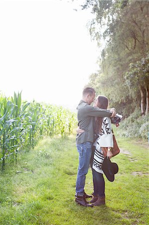 simsearch:614-08879491,k - Romantic couple hugging each other in field Stock Photo - Premium Royalty-Free, Code: 614-08879477