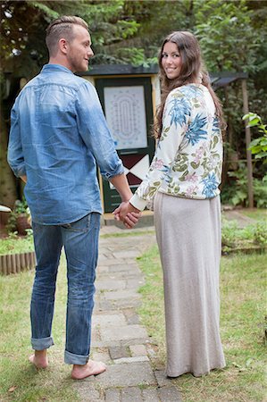 simsearch:614-08879491,k - Rear view portrait of couple holding hands in front of cabin Stock Photo - Premium Royalty-Free, Code: 614-08879517