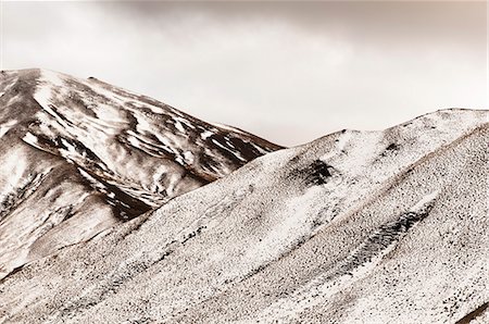 Grass and snow on mountainsides Stock Photo - Premium Royalty-Free, Code: 614-08870087