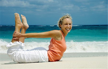 paradise island bahamas beach - Woman practicing yoga on tropical beach Stock Photo - Premium Royalty-Free, Code: 614-08870321
