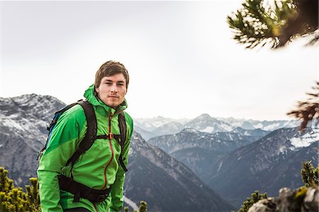 Man hiking in rural landscape Stock Photo - Premium Royalty-Free, Code: 614-08870424