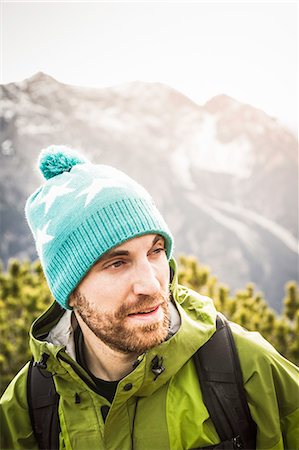 Man hiking in rural landscape Stock Photo - Premium Royalty-Free, Code: 614-08870423