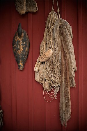 simsearch:6122-07698263,k - Fishing net hanging from wall Stock Photo - Premium Royalty-Free, Code: 614-08870456