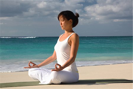 paradise island bahamas beach - Woman meditating on tropical beach Stock Photo - Premium Royalty-Free, Code: 614-08870589