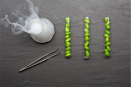 Beans in test tubes with smoking beaker Stock Photo - Premium Royalty-Free, Code: 614-08870819