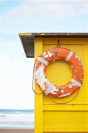 simsearch:640-08089629,k - Life preserver hanging from hut on beach Stock Photo - Premium Royalty-Free, Code: 614-08870828
