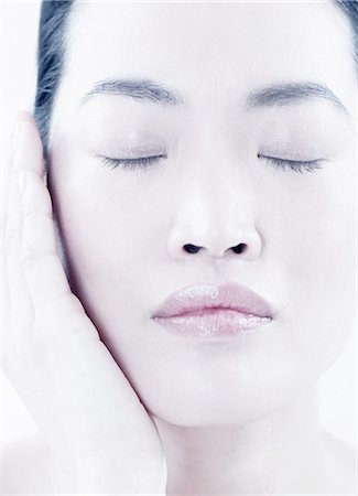 simsearch:614-08871355,k - Close up of woman holding her chin Stock Photo - Premium Royalty-Free, Code: 614-08871360