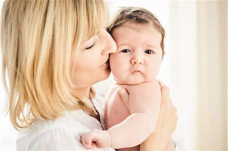 simsearch:649-06830000,k - Mid adult mother kissing baby boy Stock Photo - Premium Royalty-Free, Code: 614-08871604