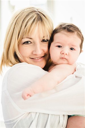 simsearch:6119-07845671,k - Portrait of mid adult mother embracing baby boy Fotografie stock - Premium Royalty-Free, Codice: 614-08871603