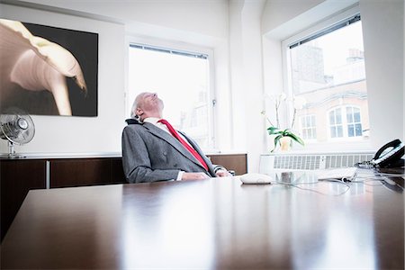 simsearch:614-07487219,k - Businessman  leaning back in chair Fotografie stock - Premium Royalty-Free, Codice: 614-08871754