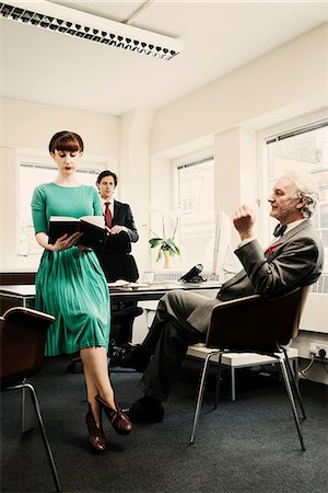 Secretary with two men in office Stock Photo - Premium Royalty-Free, Code: 614-08871769