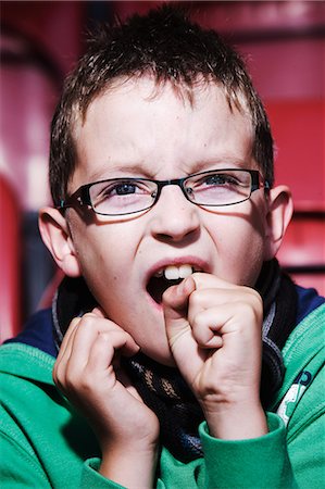 simsearch:614-03393425,k - Young boy at the cinema, biting fist Stock Photo - Premium Royalty-Free, Code: 614-08871842