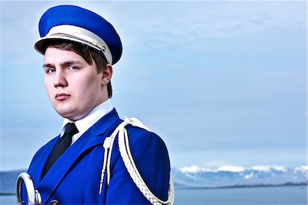 Portrait of young man wearing marching band uniform Foto de stock - Sin royalties Premium, Código: 614-08872418