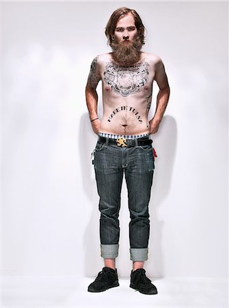 Young man with tattooed chest Stock Photo - Premium Royalty-Free, Code: 614-08872430