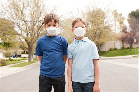 dust mask - Two boys wearing dust masks Stock Photo - Premium Royalty-Free, Code: 614-08872542