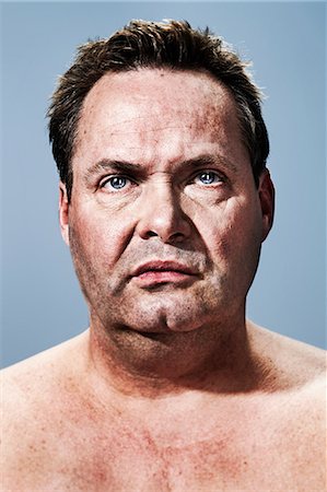 fat man looking at camera - Portrait of a serious man Stock Photo - Premium Royalty-Free, Code: 614-08872696