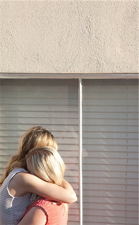 simsearch:614-05557087,k - Young lesbian couple embracing by window Stock Photo - Premium Royalty-Free, Code: 614-08872999