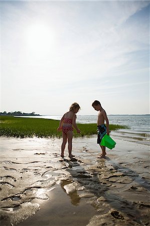 Girl and boy on beach at low tide Stock Photo - Premium Royalty-Free, Code: 614-08873238